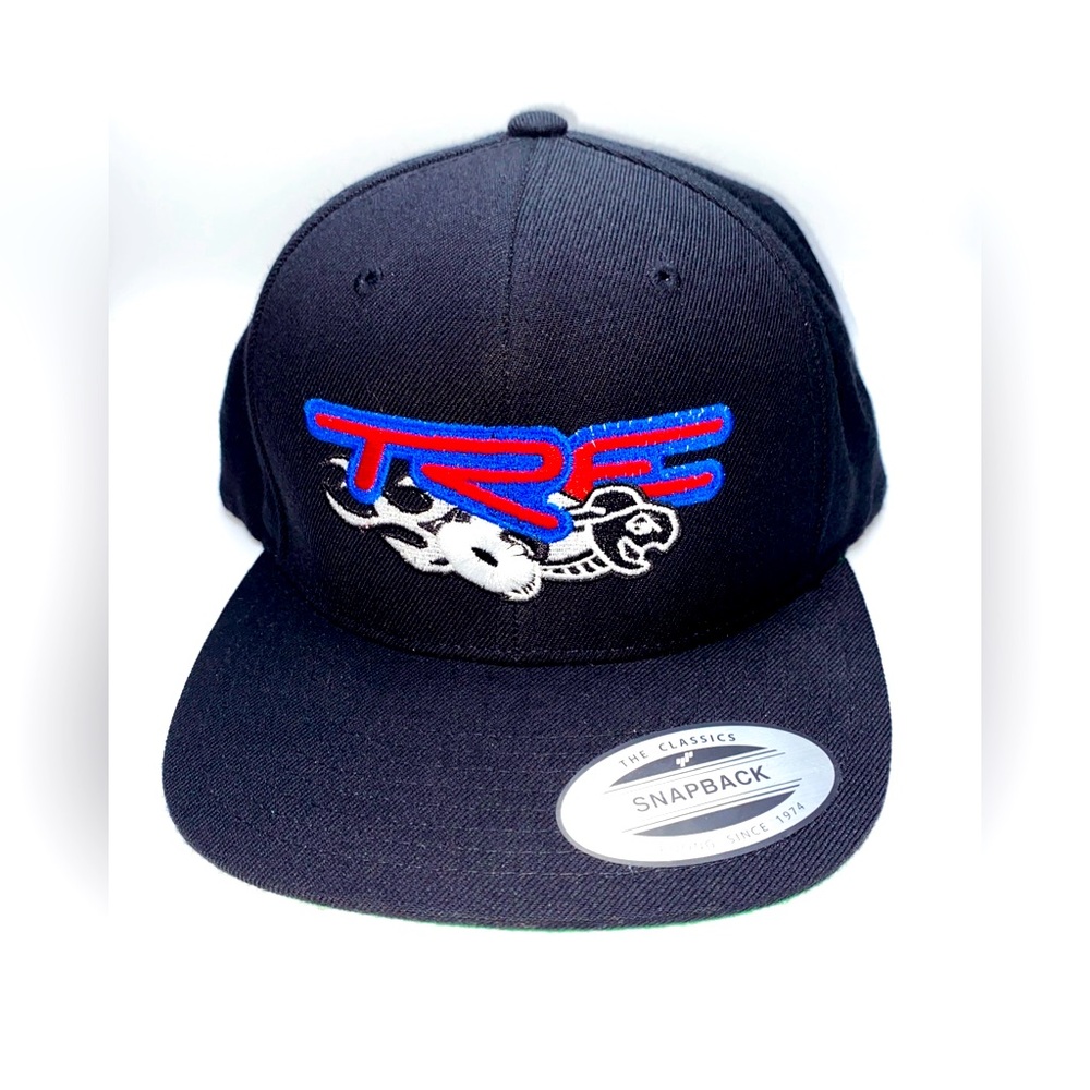 The classics yupoong black snapback  hat with tre logo red green on the inside
